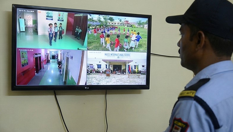 CCTV camera monitoring the school campus hallway