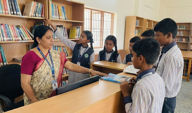 School librarian helping a student find resources at the help desk