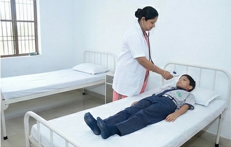Organized school dispensary with privacy screens and medicine cabinets
