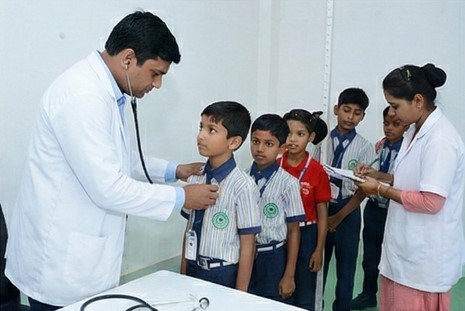 Doctor conducting a routine health check-up for a student