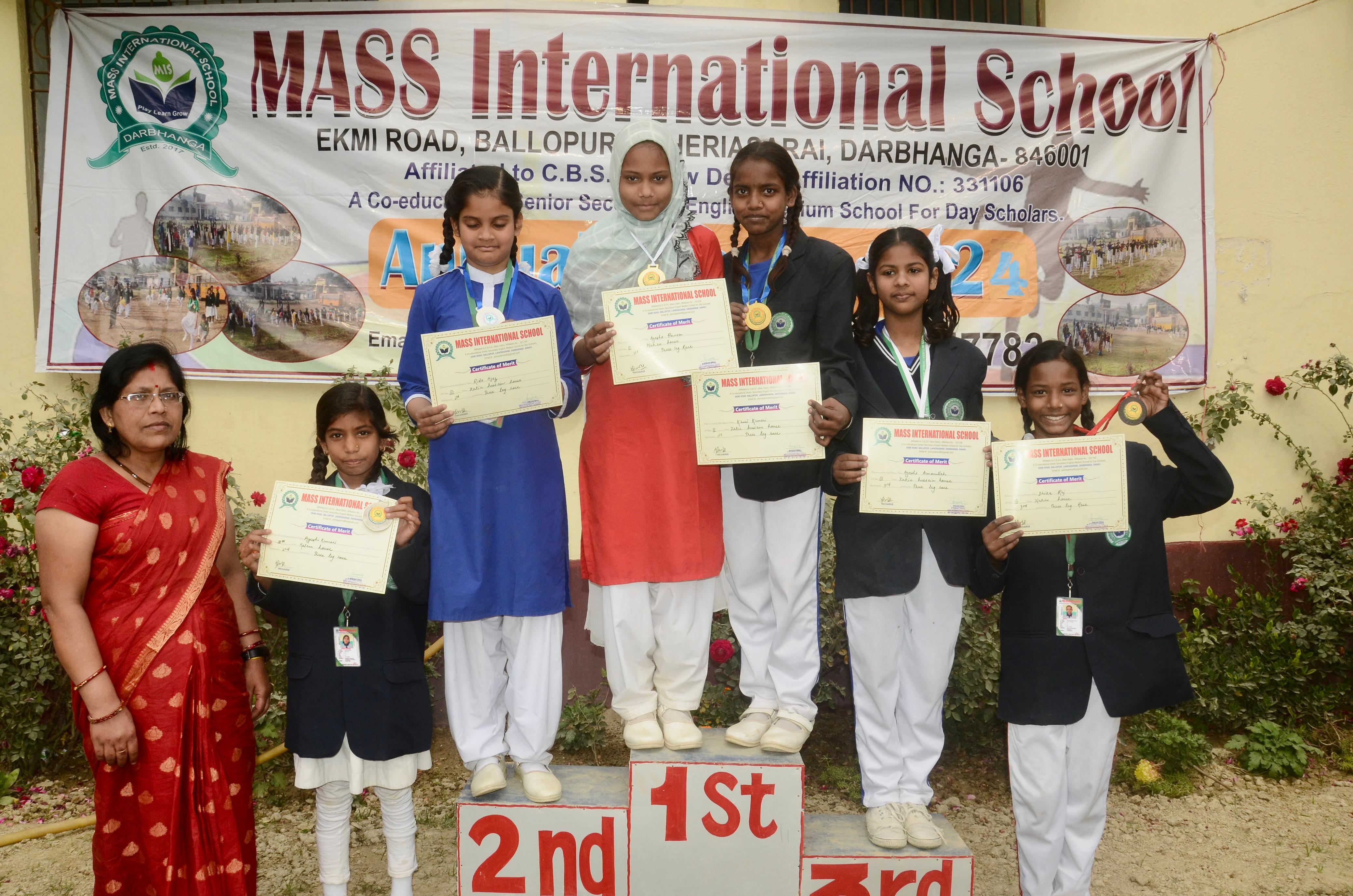 Students running on the athletic track